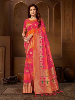Shine Bright Wearing This Designer Saree In Dark Pink And Orange Color Paired With Dark Pink Colored Blouse. This Pretty Weaved Saree Is Fabricated On Jacquard Silk Paired With Art Silk Fabricated Embroidered Blouse. 