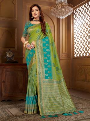 Celebrate This Festive Wearing This Designer Saree In Green And BLue Color Paired With Blue Colored Blouse. This Saree Is Fabricated On Jacquard Silk Paired With Art Silk Fabricated Blouse. Its Saree Is Beautified With Weave Paired With Embroidered Blouse. 