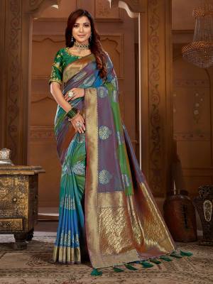 Shine Bright Wearing This Designer Saree In Multi Color Paired With Teal Green Colored Blouse. This Pretty Weaved Saree Is Fabricated On Jacquard Silk Paired With Art Silk Fabricated Embroidered Blouse. 