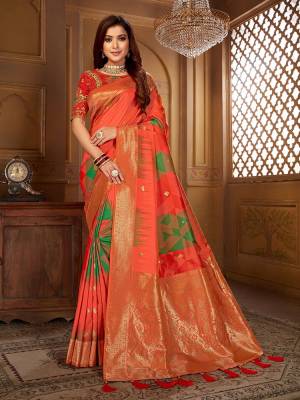 Celebrate This Festive Wearing This Designer Saree In Orange Color Paired With Red Colored Blouse. This Saree Is Fabricated On Jacquard Silk Paired With Art Silk Fabricated Blouse. Its Saree Is Beautified With Weave Paired With Embroidered Blouse. 