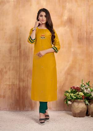 Celebrate This Festive Season Wearing This Readymade Kurti In Yellow color Paired With Contrasting Teal Green Colored Bottom. Its Top and Bottom Are Muslin Based Which Ensures Superb Comfort All Day Long. 