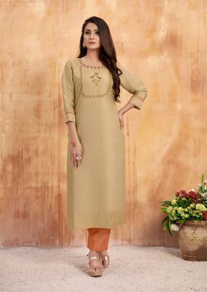 Simple And Elegant Looking Designer Readymade Kurti Is Here In Beige Color Paired With Rust Orange Colored Bottom. Its Top Is Fabricated On Tussar Satin Paired With Art Silk Fabricated Bottom. 