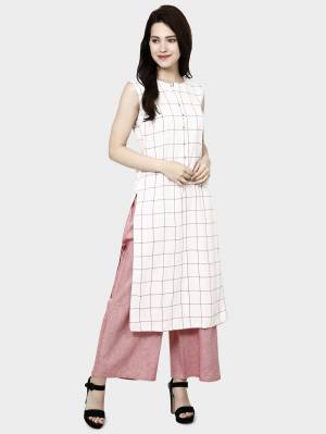Look Pretty Wearing This Readymade Kurti In White Color Paired With Pink Colored plazzo. This Readymade Pair Is Cotton Based Beautified With Prints. Buy Now.