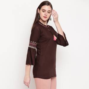 Be It Your College, Home Or Work Place, This Top Is Suitable For All In Brown Color. It IS Fabricated On Rayon And Can Be Paired With Denims. 