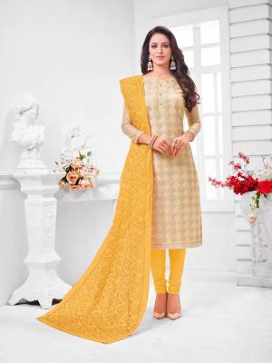 Grab This Designer Straight Suit For Your Semi-Casual Wear In Beige Color Paired With Yellow Colored Bottom and Dupatta. Its Top and Dupatta Are Modal Silk Based Paired With Cotton Bottom.