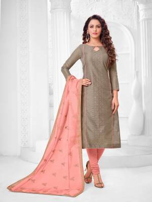 Grab This Designer Straight Suit For Your Semi-Casual Wear In Brown Color Paired With Pink Colored Bottom and Dupatta. Its Top and Dupatta Are Modal Silk Based Paired With Cotton Bottom.