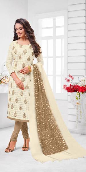 Add This Pretty Suit To Your Wardrobe In Cream colored Top Paired With Contrasting Brown Colored Bottom and Dupatta. Its Top Is Fabricated On Modal Checks Paired With Cotton Bottom and Dupatta.