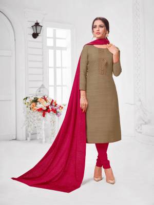 You Will Definitely Earn Lots Of Compliments Wearing This Designer Straight Suit In Brown Colored Top Paired With Maroon Colored Bottom And Dupatta. Its Top Is Fancy Fabric Based Paired With Cotton Bottom and Soft SilkFabricated Dupatta