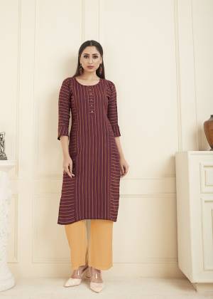 Here Is A Printed Readymade Straight Cut Kurti For Your Casual Or Semi-Casual Wear In Maroon Color. This Lining Printed Kurti Is Fabricated On Cotton And Can Be Paired With Same Or Contrasting Colored Leggings, Pants Or Plazzo. Buy now.