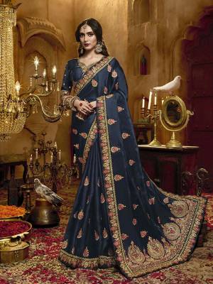 You Will Definitely Earn Lots Of Compliments Wearing This Heavy Embroidered Designer Saree In Navy Blue Color Paired With Navy Blue Colored Blouse. This Pretty Saree Is Satin Silk Based Paired With Art Silk Fabricated Blouse. 