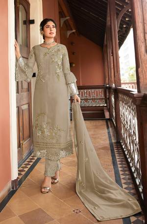 Flaunt Your Rich And Elegant Taste Wearing This Designer Straight Suit In Sand Grey Color. Its Pretty Top Is Fabricated On Satin Georgette Paired With Santoon Bottom And Chiffon Fabricated Dupatta. Its Top, Bottom And Dupatta Are Beautified With Detailed Embroidery Which Gives An Elegant Look. 
