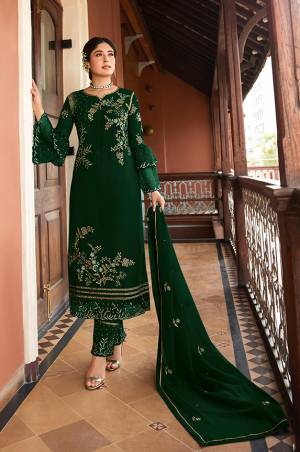 This Festive And Wedding Season, Be The Most Beautiful Diva Wearing This Designer Straight Suit In Dark Green Color. Its Embroidered Top Is Fabricated on Satin Georgette Paired With Santoon Bottom And Chiffon Dupatta. Buy Now.