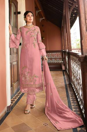Flaunt Your Rich And Elegant Taste Wearing This Designer Straight Suit In Pink Color. Its Pretty Top Is Fabricated On Satin Georgette Paired With Santoon Bottom And Chiffon Fabricated Dupatta. Its Top, Bottom And Dupatta Are Beautified With Detailed Embroidery Which Gives An Elegant Look. 