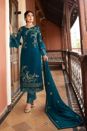 Flaunt Your Rich And Elegant Taste Wearing This Designer Straight Suit In Blue Color. Its Pretty Top Is Fabricated On Satin Georgette Paired With Santoon Bottom And Chiffon Fabricated Dupatta. Its Top, Bottom And Dupatta Are Beautified With Detailed Embroidery Which Gives An Elegant Look. 