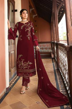 This Festive And Wedding Season, Be The Most Beautiful Diva Wearing This Designer Straight Suit In Maroon Color. Its Embroidered Top Is Fabricated on Satin Georgette Paired With Santoon Bottom And Chiffon Dupatta. Buy Now.