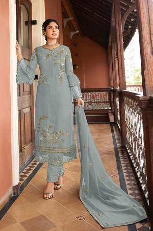 Flaunt Your Rich And Elegant Taste Wearing This Designer Straight Suit In Grey Color. Its Pretty Top Is Fabricated On Satin Georgette Paired With Santoon Bottom And Chiffon Fabricated Dupatta. Its Top, Bottom And Dupatta Are Beautified With Detailed Embroidery Which Gives An Elegant Look. 