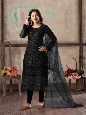 Here Is A Very Beautiful Designer Straight Suit In All Over Black Color. Its Heavy Embroidered Top Is Fabricated On Net Paired With Santoon Bottom And Net Fabricated Dupatta. Its Top Is Beautified With Heavy Tone To Tone Embroidery Which Gives A Rich And Elegant Look To Your Personality. 