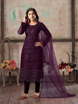 Here Is A Very Beautiful Designer Straight Suit In All Over Wine Color. Its Heavy Embroidered Top Is Fabricated On Net Paired With Santoon Bottom And Net Fabricated Dupatta. Its Top Is Beautified With Heavy Tone To Tone Embroidery Which Gives A Rich And Elegant Look To Your Personality. 