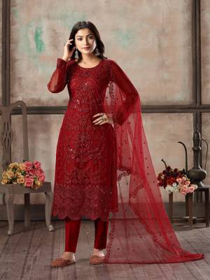 Here Is A Very Beautiful Designer Straight Suit In All Over Red Color. Its Heavy Embroidered Top Is Fabricated On Net Paired With Santoon Bottom And Net Fabricated Dupatta. Its Top Is Beautified With Heavy Tone To Tone Embroidery Which Gives A Rich And Elegant Look To Your Personality. 
