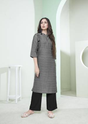 Here Is A Pretty Simple Lining Printed Readymade Kurti In Grey Color. This Pretty Kurti Is Fabricated On Cotton And It Can Be Paired With Pants, Plazzo Or Leggings. Also It Is Available In All Regular Sizes. Buy Now.