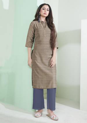 Here Is A Pretty Simple Lining Printed Readymade Kurti In Light Brown Color. This Pretty Kurti Is Fabricated On Cotton And It Can Be Paired With Pants, Plazzo Or Leggings. Also It Is Available In All Regular Sizes. Buy Now.