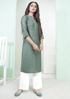 Here Is A Pretty Simple Lining Printed Readymade Kurti In Teal Green Color. This Pretty Kurti Is Fabricated On Cotton And It Can Be Paired With Pants, Plazzo Or Leggings. Also It Is Available In All Regular Sizes. Buy Now.
