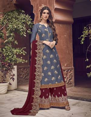 Grab This Very Beautiful Designer Straight Suit In Dark Grey Color Paired With Contrasting Maroon Colored Bottom And Dupatta. Its Top Is Fabricated On Jacquard Silk Paired With Art Silk Fabricated Bottom and Chiffon Dupatta. 