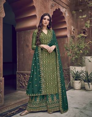 Go with The Lovely Shades Of Green Wearing This Designer Straight Suit In Green Colored Top Paired With Teal Green Colored Bottom and Dupatta. Its Top Is Fabricated On Jacquard Silk Paired With Art Silk Fabricated Bottom And Chiffon Fabricated Dupatta with Embroidery. 
