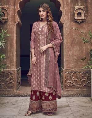 Look Pretty In This Dusty Pink colored Designer Straight Suit Paired With Maroon colored Bottom. Its Embroidered Top Is Jacquard Silk Based Paired With Art Silk Bottom and Chiffon Fabricated Dupatta. Buy Now.
