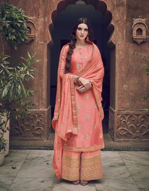 Here Is A Designer Heavy Straight Suit In Peach Color. Its Top Is Fabricated On Jacquard Silk Paired With Art Silk Fabricated Bottom Paired With Chiffon Fabricated Dupatta. It Is Beautified With Heavy Embroidery Giving An Attractive Look. 