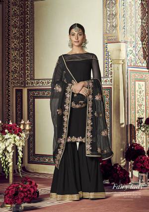 For A Bold And Beautiful Look, Grab This Elegant Looking Designer Sharara Suit In Black Color. Its Top And Bottom Are Georgette Based Paired With Net Fabricated Dupattta. Buy Now.