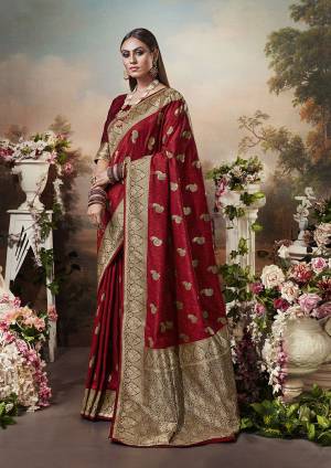 For A Royal Look, Grab This Designer Silk Based Saree In Red Color. This Heavy Weaved Saree Is Fabricated On Banarasi Silk Paired With Art Silk Fabricated Blouse. Pair This Up Pearl Or Stone Accessories For A Complete Rich Look.