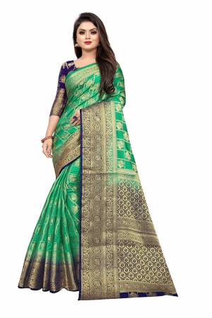 Celebrate This Festive Season In A Proper Traditonal Look Wearing This Silk Based Saree In Sea Green Color Paired With Royal Blue Colored Blouse. This Saree And Blouse Are Fabricated On Art Silk Beautified with Weave. 