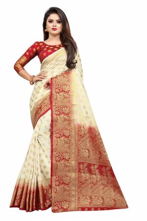 Grab This Beautiful Designer Weaved Saree In Cream color Paired With Red Colored Blouse. This Saree And Blouse Are Fabricated On Art Silk Which Also Gives A Rich Look To Your Personality. 