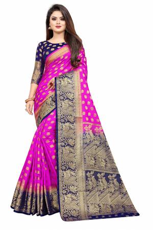 Grab This Beautiful Designer Weaved Saree In Rani Pink color Paired With Royal Blue Colored Blouse. This Saree And Blouse Are Fabricated On Art Silk Which Also Gives A Rich Look To Your Personality. 