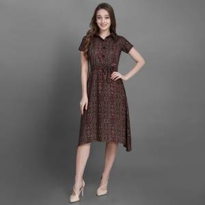 Here Is A Pretty Readymade Kurti In Brown Color Fabricated On Rayon Beautified With Prints All Over. It Is Light In Weight And Easy To Carry All Day Long. 