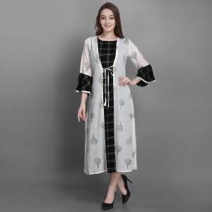 Grab This Pretty Readymade Kurti In Black Color Fabricated On Cotton Paired With A White Colored Jacket Fabricated On Georgette. Buy This Pair Of Kurti With Jacket Now.