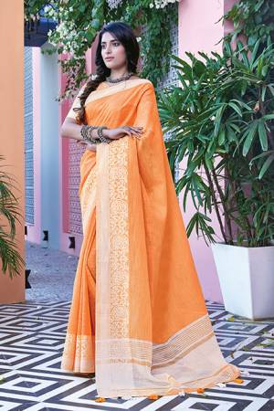 Simple And Elegant Looking Saree Is Here In Orange Color Paired With Orange Colored Blouse. This Saree And Blouse Are Fabricated On Linen Cotton Beautified With Weave. Buy This Saree Now.