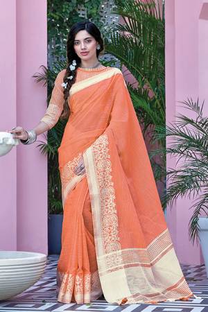 Simple And Elegant Looking Saree Is Here In Orange Color Paired With Orange Colored Blouse. This Saree And Blouse Are Fabricated On Linen Cotton Beautified With Weave. Buy This Saree Now.