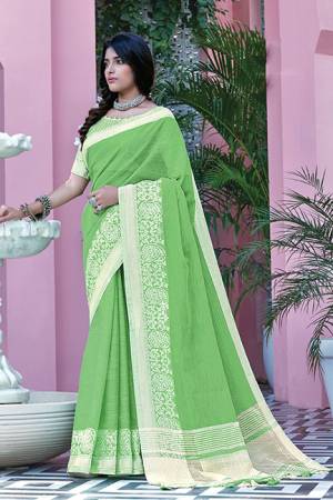 Simple And Elegant Looking Saree Is Here In Green Color Paired With Green Colored Blouse. This Saree And Blouse Are Fabricated On Linen Cotton Beautified With Weave. Buy This Saree Now.