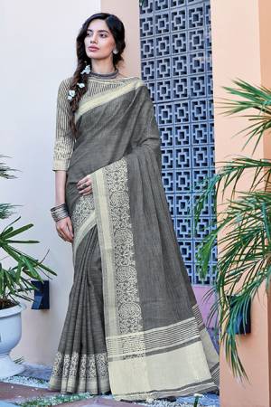 Simple And Elegant Looking Saree Is Here In Grey Color Paired With Grey Colored Blouse. This Saree And Blouse Are Fabricated On Linen Cotton Beautified With Weave. Buy This Saree Now.