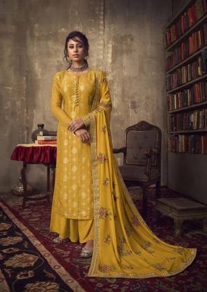 Celebrate This Festive Season Wearing This Designer Straight Suit In Musturd Yellow Color. Its Pretty Top Is Jacquard Silk Based Paired With Santoon Bottom And Chinon Chiffon Fabricated Dupatta. 