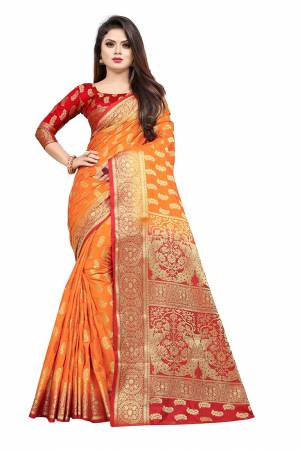 Celebrate This Festive Season In A Proper Traditonal Look Wearing This Silk Based Saree In Orange Color Paired With Red Colored Blouse. This Saree And Blouse Are Fabricated On Art Silk Beautified with Weave. 