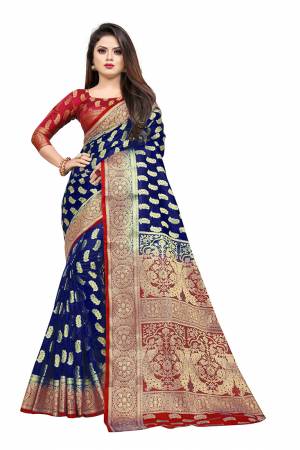 Celebrate This Festive Season In A Proper Traditonal Look Wearing This Silk Based Saree In Royal Blue Color Paired With Red Colored Blouse. This Saree And Blouse Are Fabricated On Art Silk Beautified with Weave. 