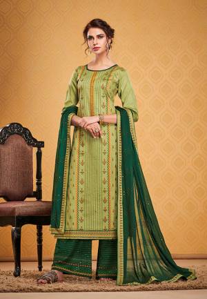 Celebrate This Festive Season With Beauty And Comfort Wearing This Designer Straight Suit In Light Green Color Paired With Dark Green Colored Bottom And Dupatta. Its Top Is Fabricated On Cotton Silk Paired With Rayon Silk Bottom And Chinon Fabricated Dupatta. 
