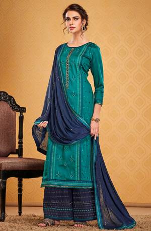 You Will Definitely Earn Lots Of Compliments Wearing This Designer Straight Suit In Blue Color Paired With Navy Blue Colored Bottom and Dupatta. Its Top Is Fabricated On Cotton Silk Paired With Rayon Silk Bottom and Chinon Fabricated Dupatta. 