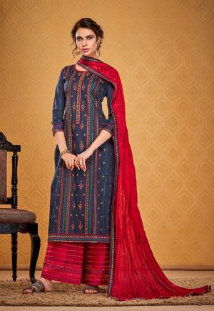 Look Attractive Wearing This Pretty Designer Straight suit In Navy Blue Colored Top Paired With Contrasting Red Colored Bottom and Dupatta. Its Top Is Cotton Silk Based Paired With Rayon Silk Bottom And Chinon Dupatta. Its Fabrics Gives A Rich Look To Your Personality. 