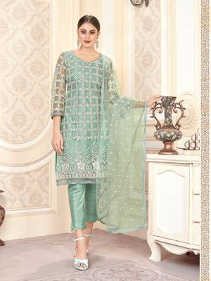 Look Pretty In This Designer Straight Suit In Dusty Green Color. IT Heavy Embroidered Top And Dupatta Are Net Based Paired With Santoon Fabricated Bottom. ItsPretty Color And elegant Embroidery Will Give A Rich Look To Your Personality. 