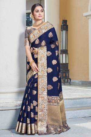 Here Is Pretty Rich Looking Silk Based Saree In Navy Blue Color Paired With Navy Blue Colored Blouse. This Saree And Blouse Are Fabricated On Art Silk Beautified With Weave All Over. 