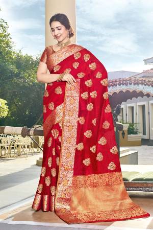 Here Is Pretty Rich Looking Silk Based Saree In Red Color Paired With Navy Blue Colored Blouse. This Saree And Blouse Are Fabricated On Art Silk Beautified With Weave All Over. 